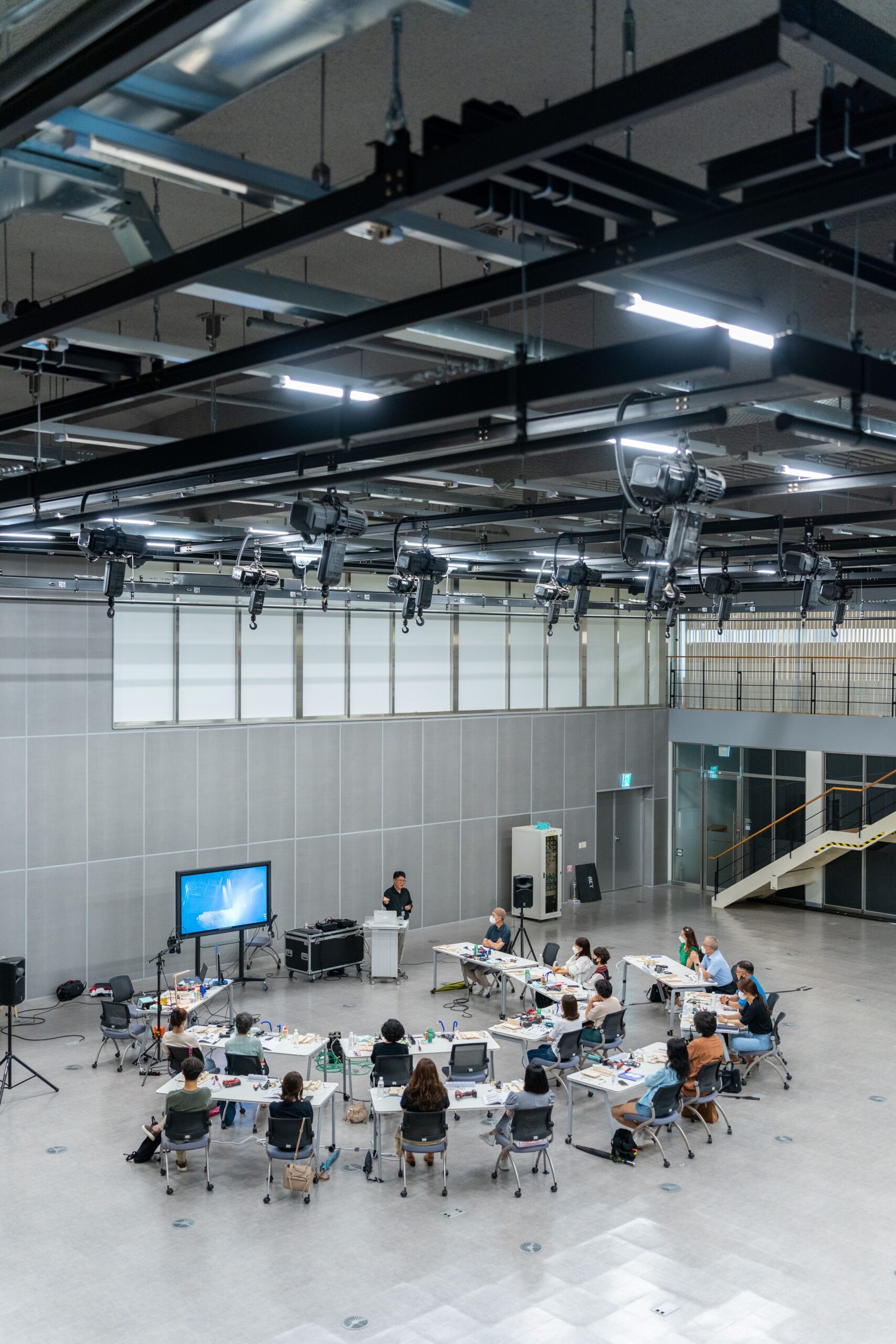 Aerial view of a spacious conference room setup for a business presentation.
